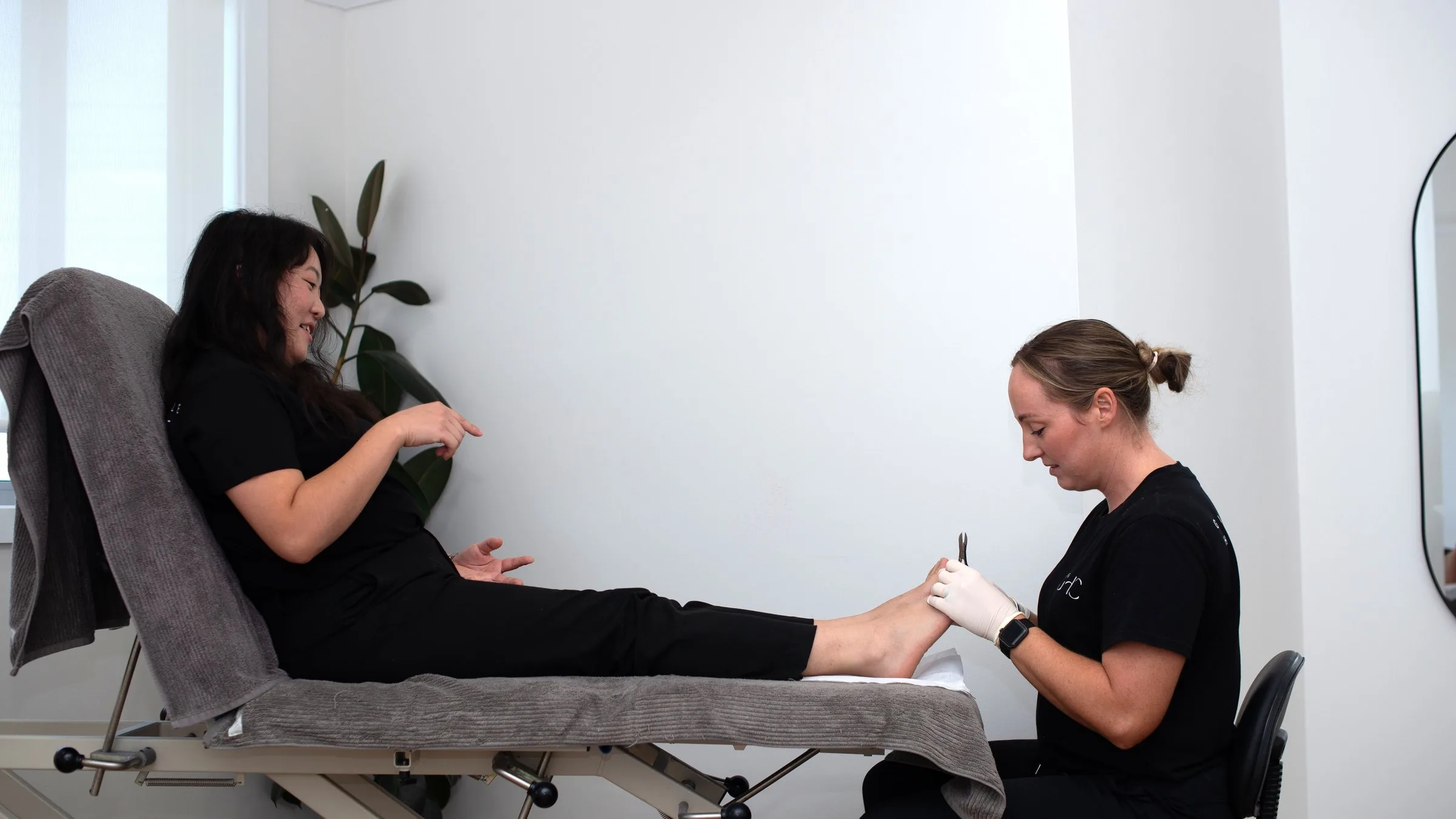 Physiotherapist treating a patient's hip and leg
