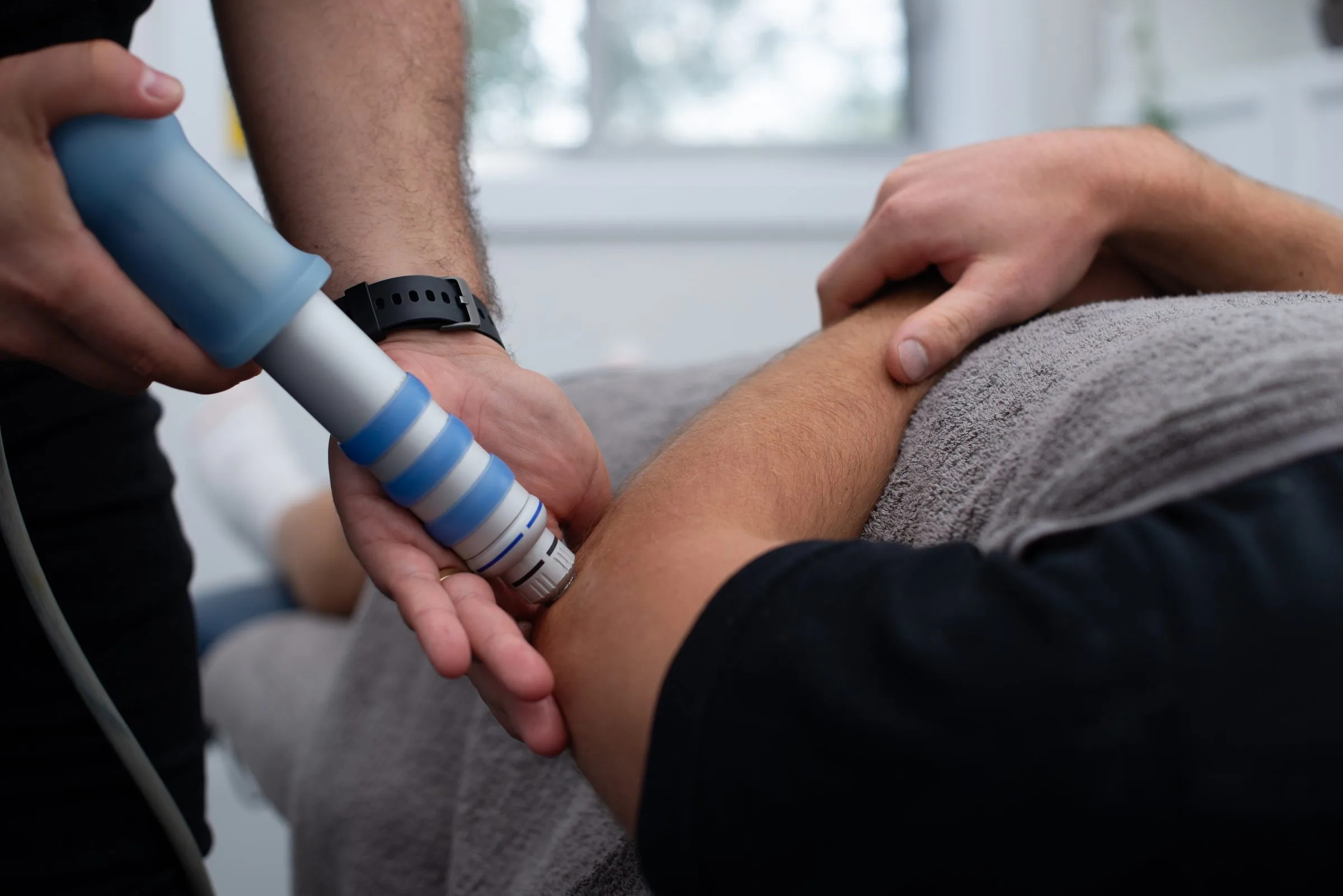 Radial shockwave therapy being applied at Gladesville Healthcare