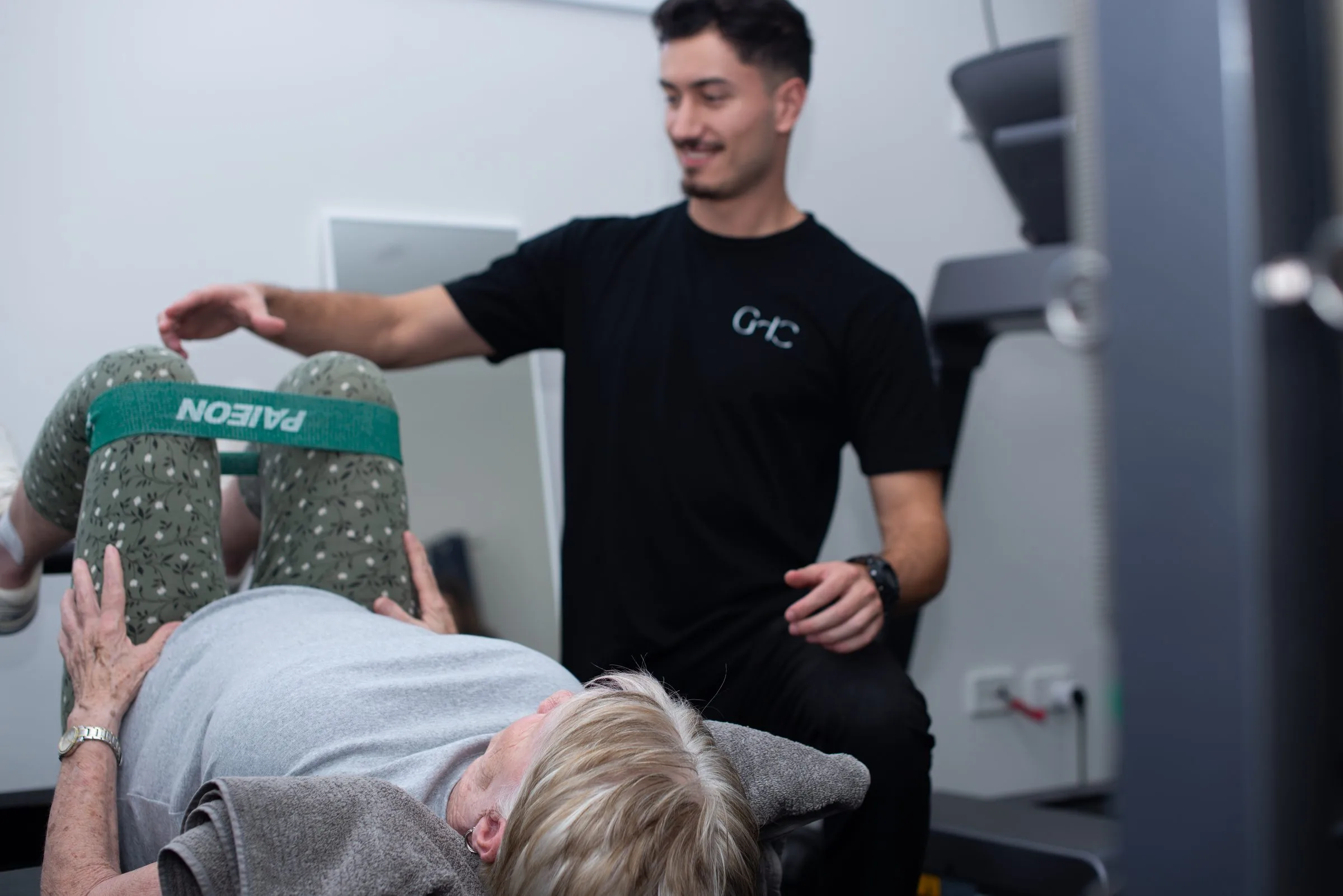 Client working through a supervised exercise on the gym equipment