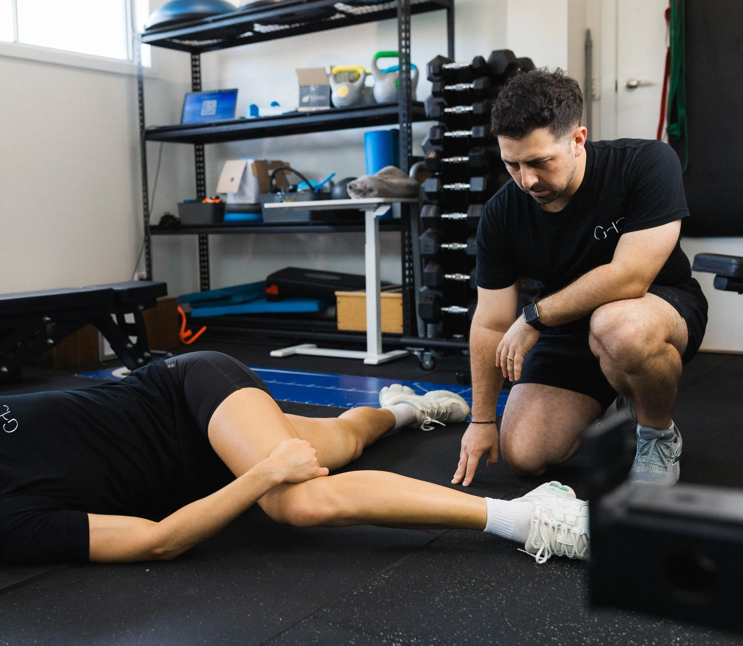 Sports physiotherapist treating an athlete at Gladesville Healthcare