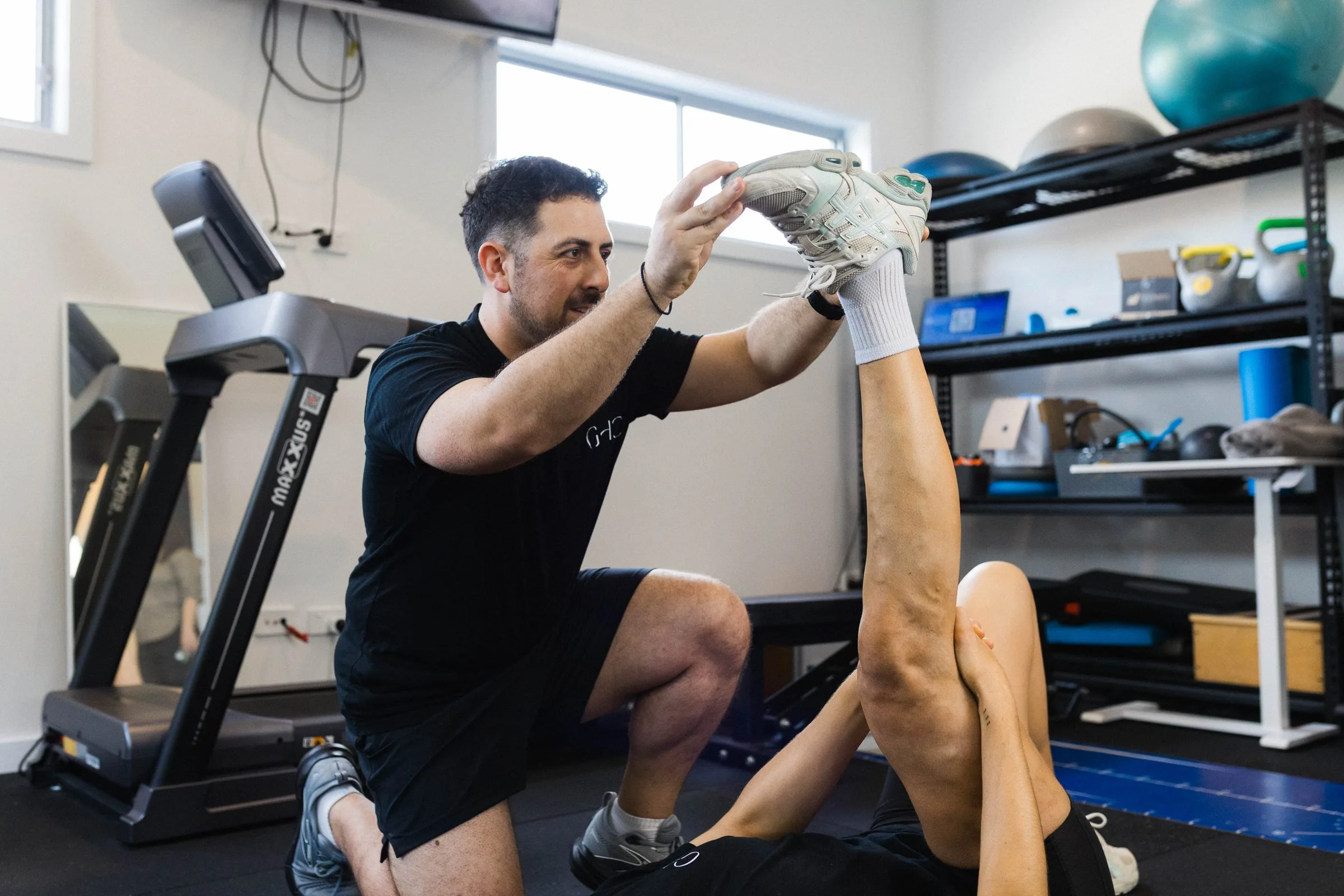 Patient working through a rehabilitation program in the clinic gym