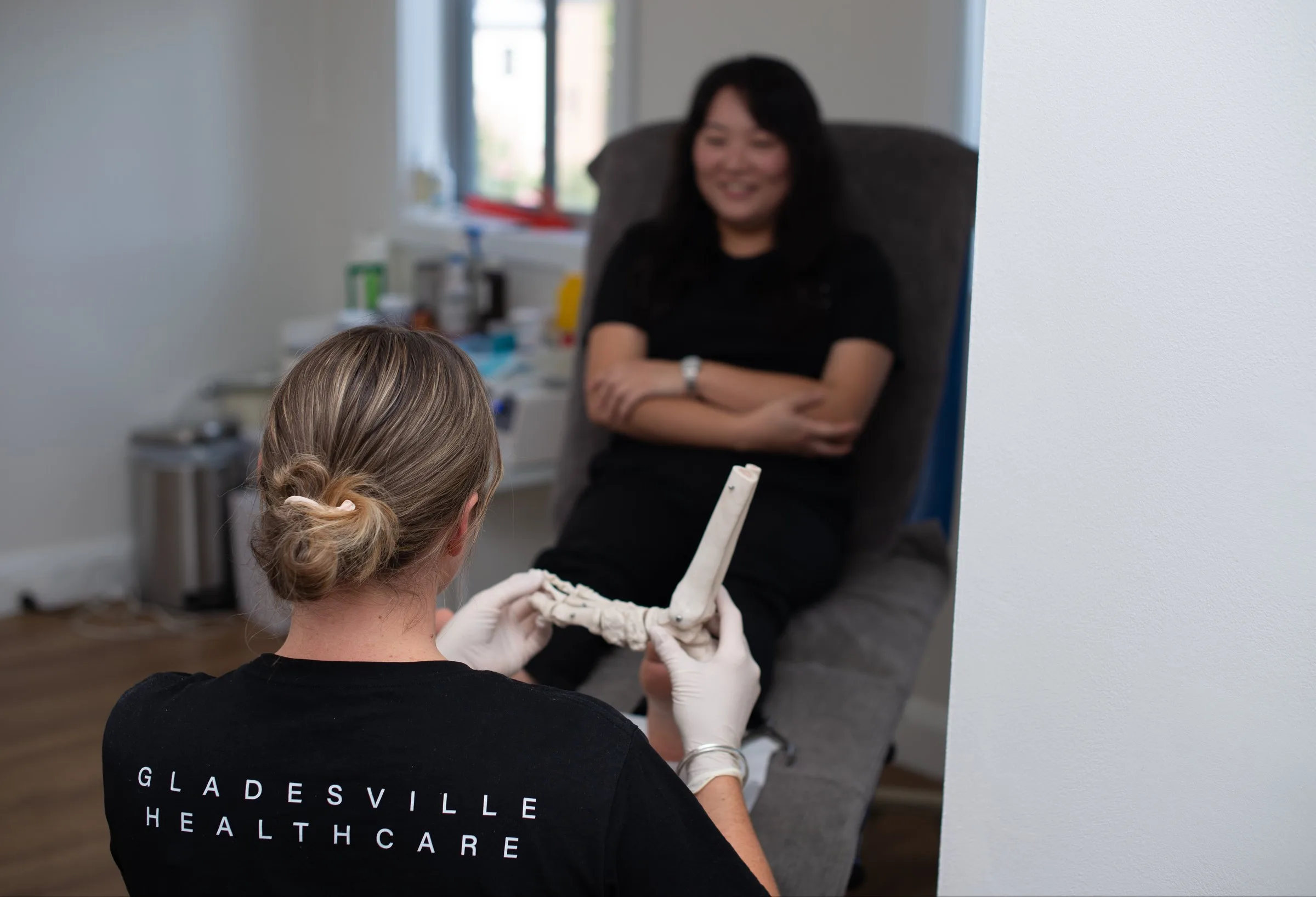 Podiatrist discussing a treatment plan with a patient