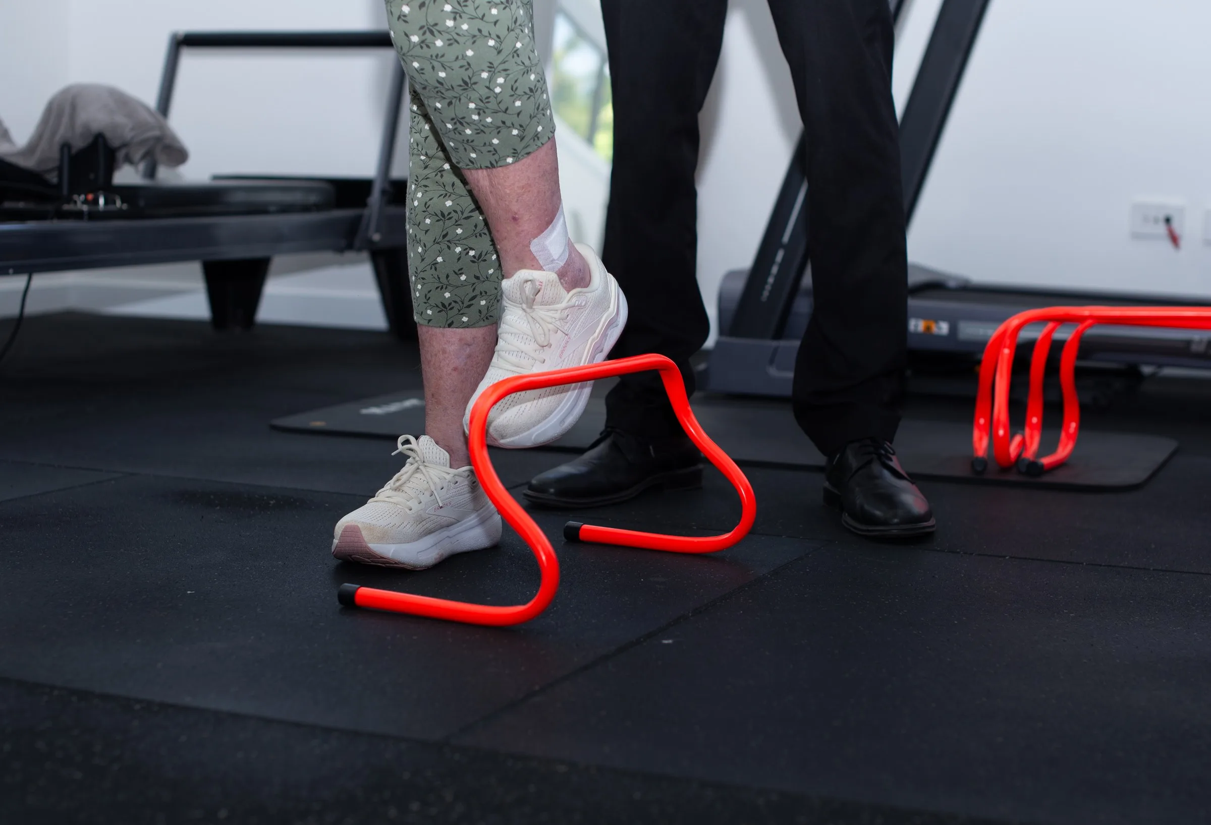Client working through a mobility exercise